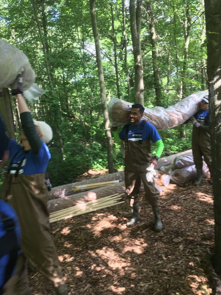 CTW volunteers bringing coir logs to buffer streams